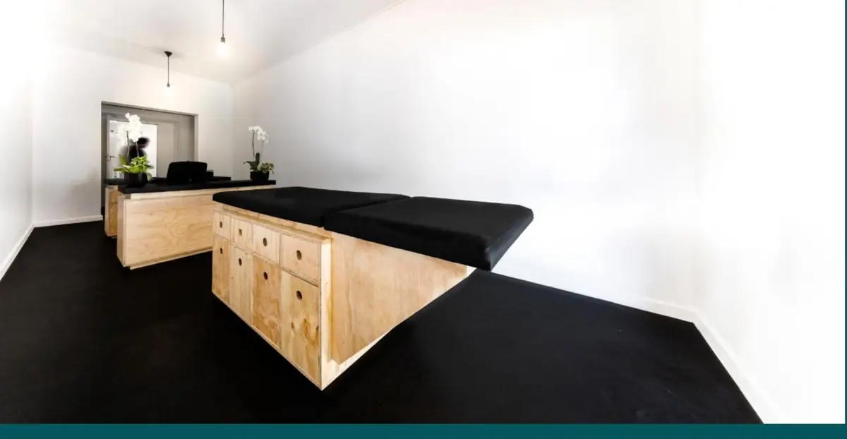 A reception and treatment area at an Epione Health Village, built from locally-made plywood joinery.